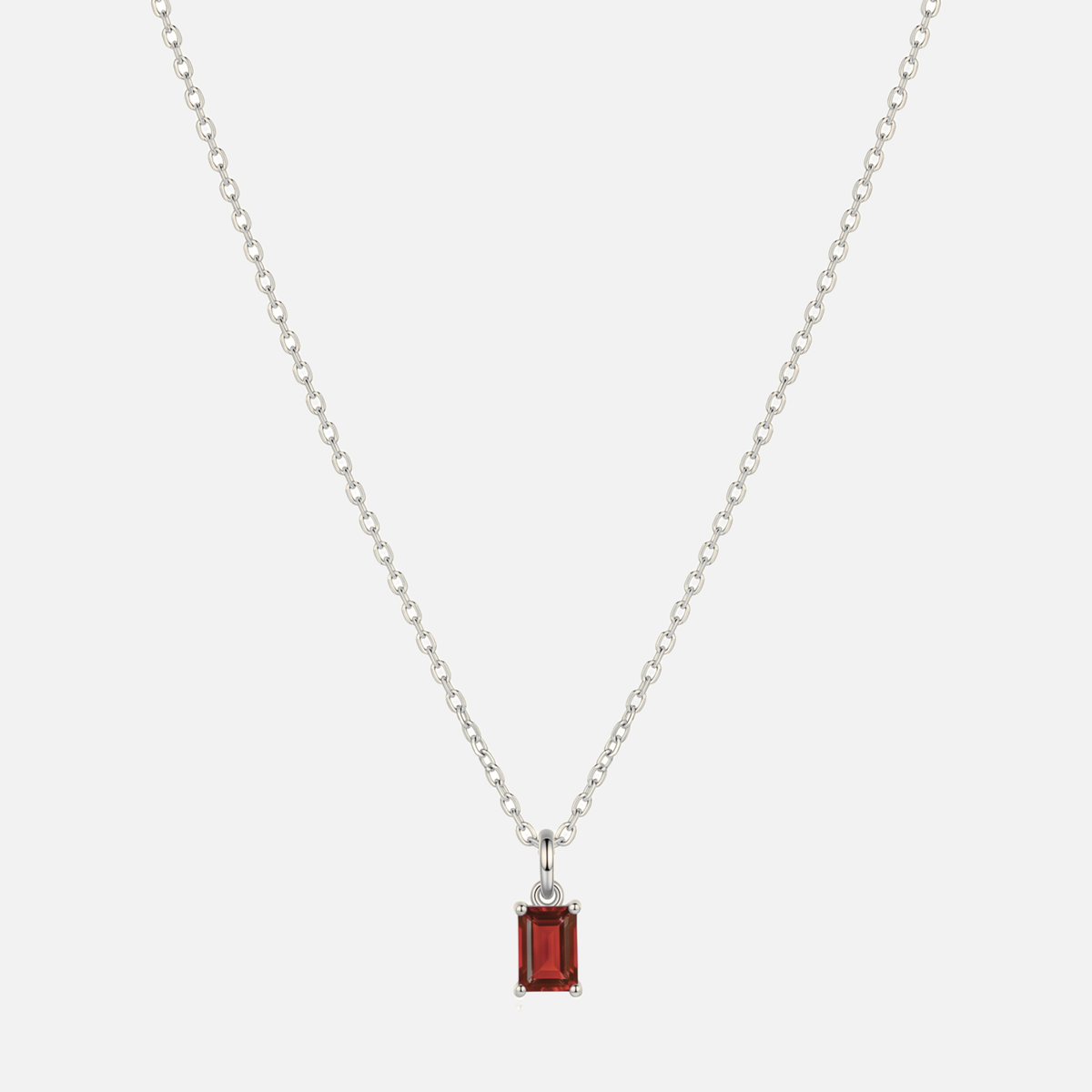 Éclat baguette birthstone necklace in silver with a January garnet-coloured birthstone