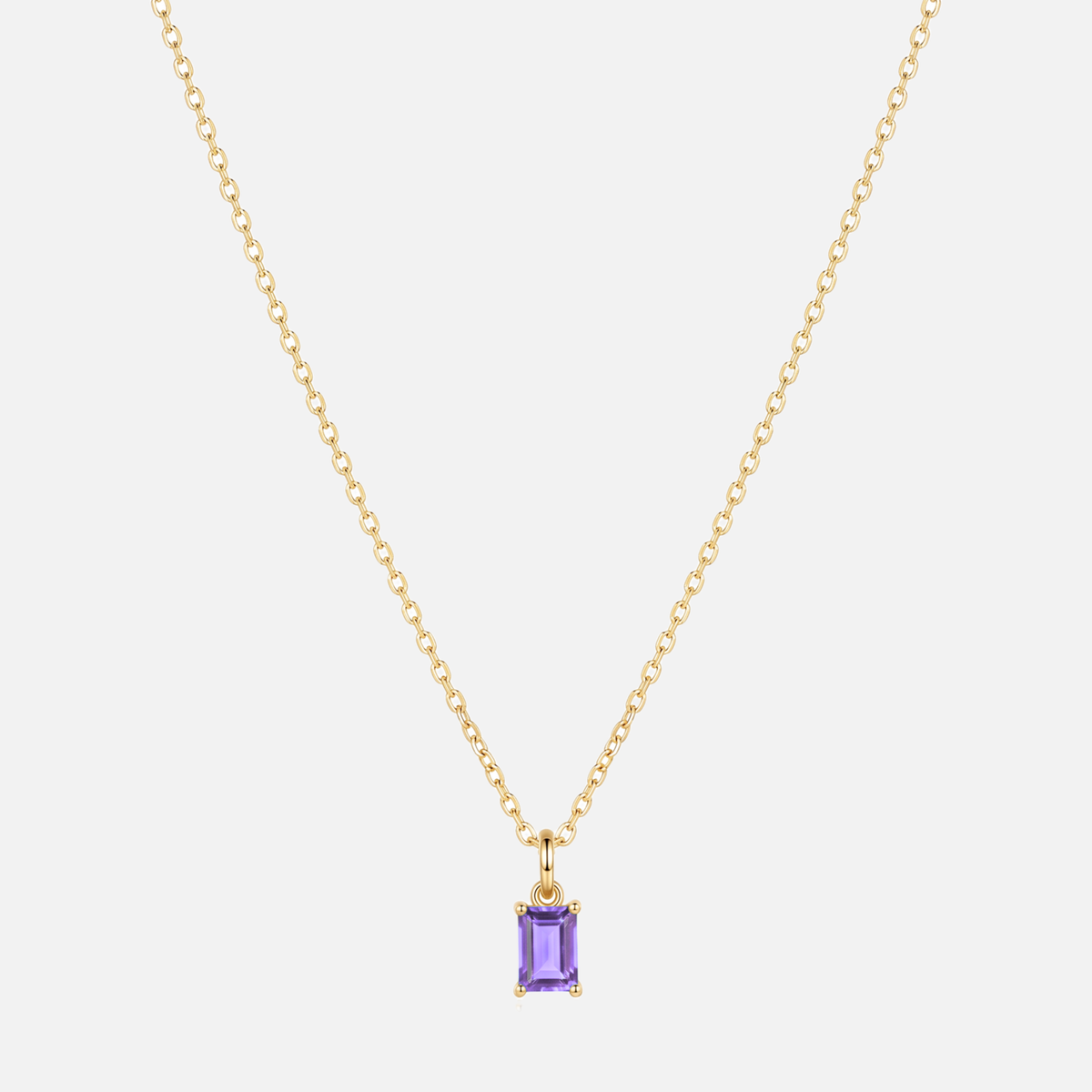 Éclat baguette birthstone necklace in gold with a February amethyst-coloured birthstone