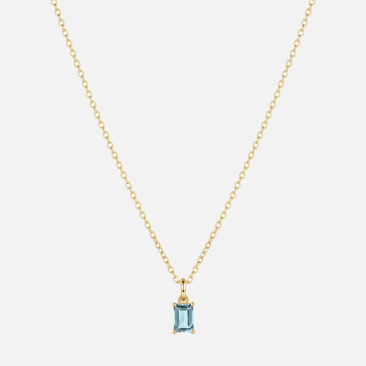 Éclat baguette birthstone necklace in gold with a March aquamarine-coloured birthstone