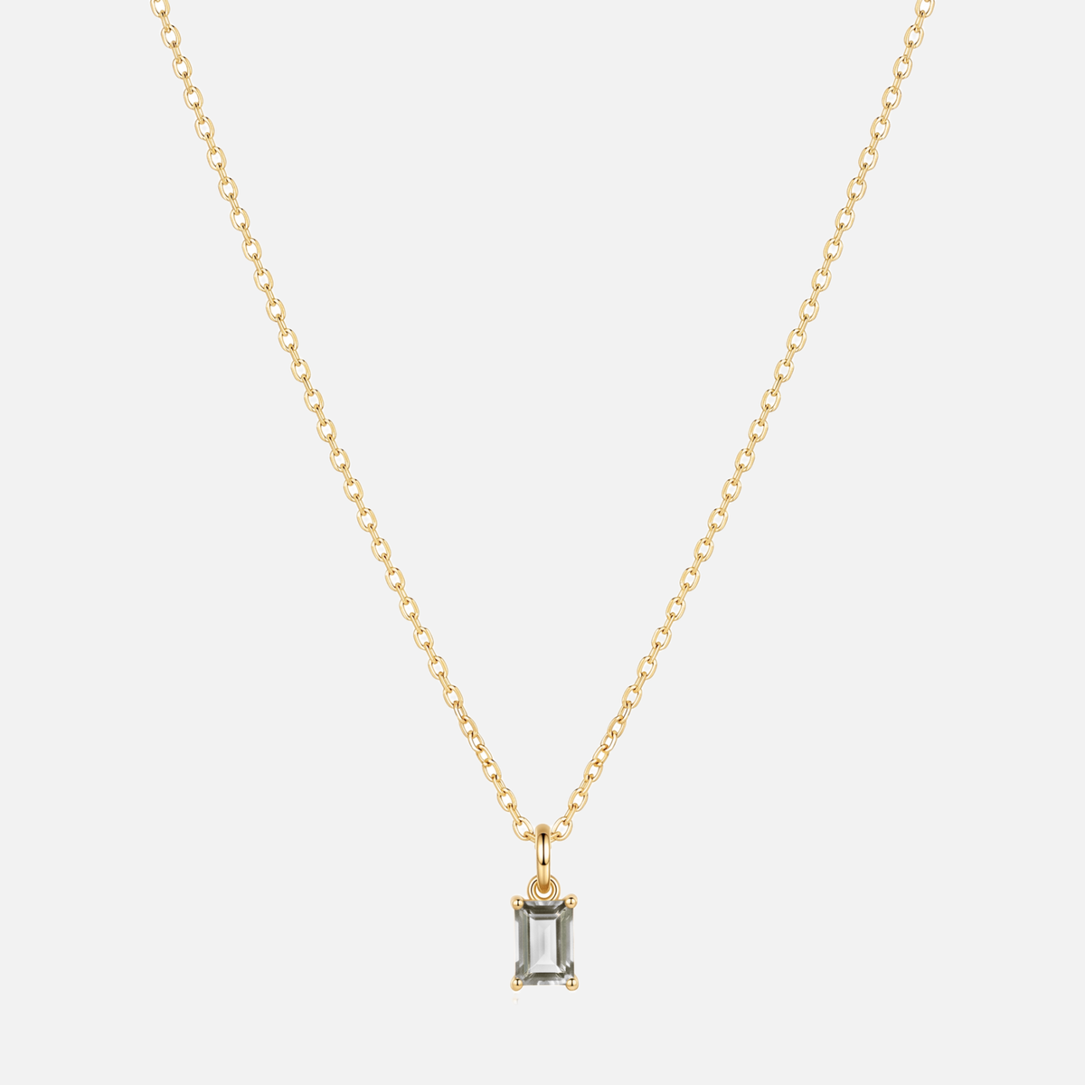 Éclat baguette birthstone necklace in gold with an April clear moissanite-style birthstone