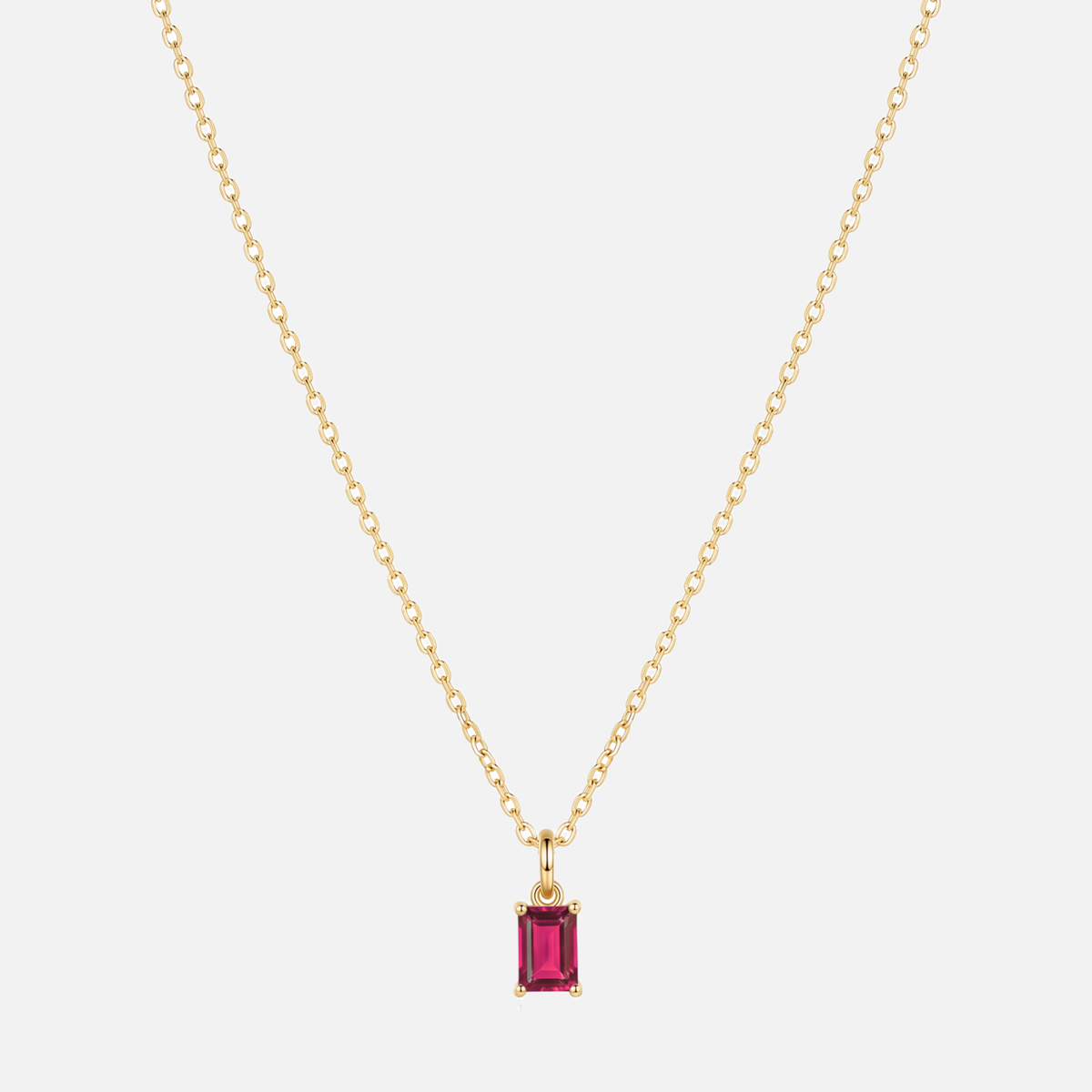 Éclat baguette birthstone necklace in gold with a July ruby-coloured birthstone
