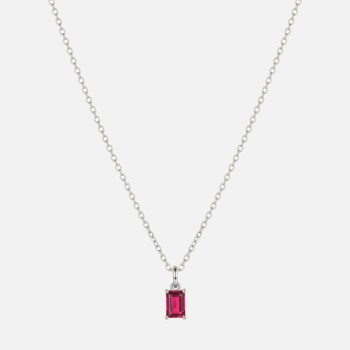 Éclat baguette birthstone necklace in silver with a July ruby-coloured birthstone