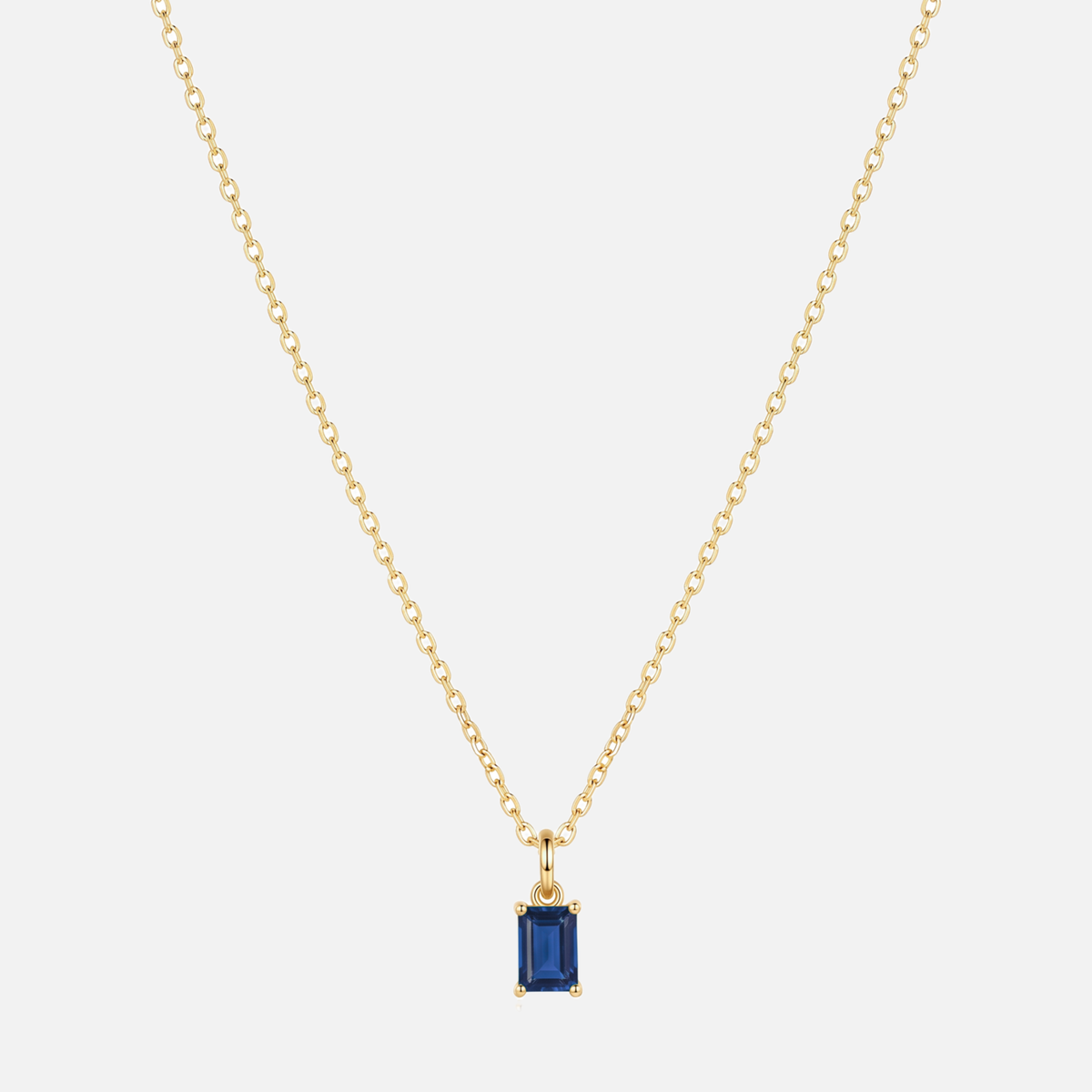 Éclat baguette birthstone necklace in gold with a September sapphire-coloured birthstone