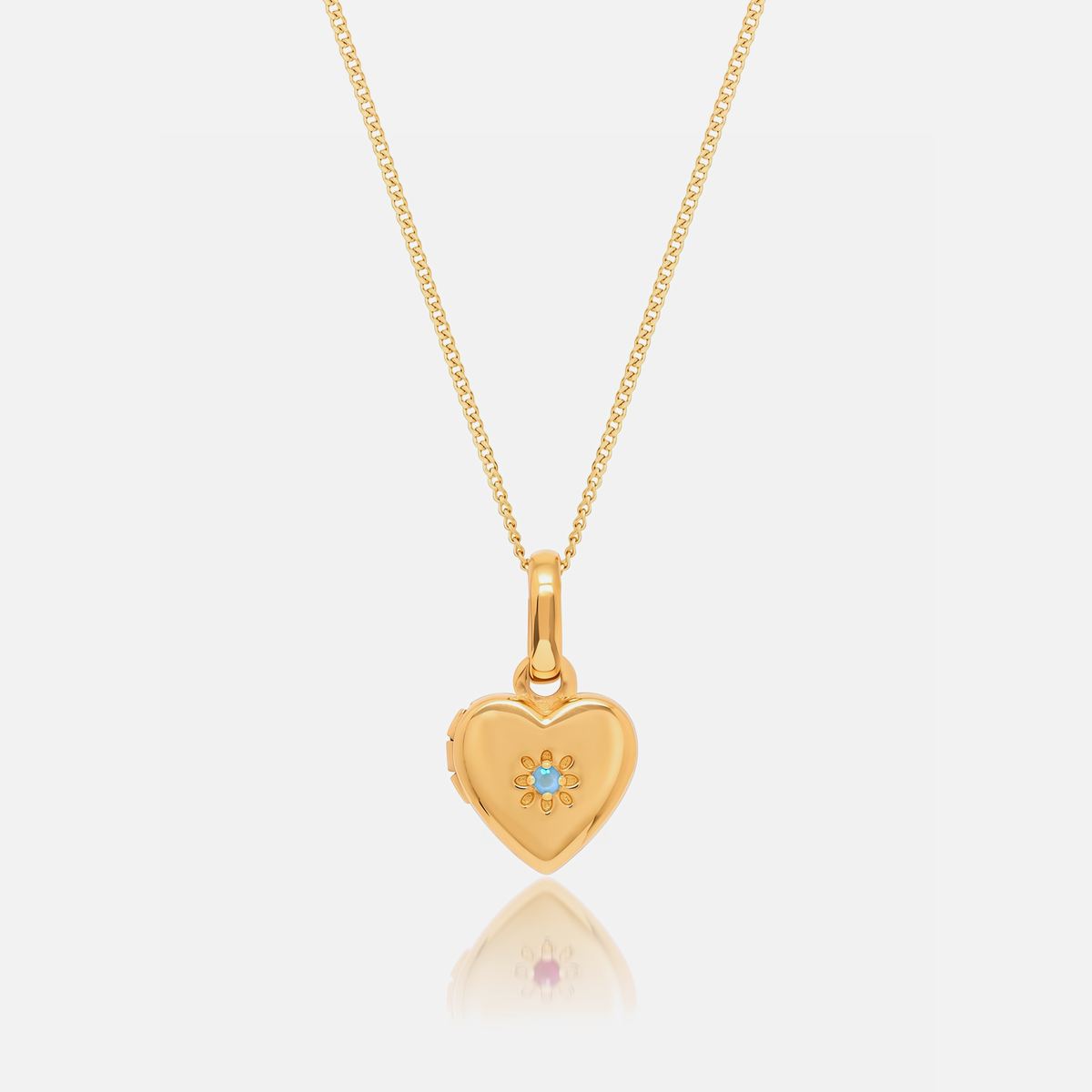 Close-up of the Gold Birthstone Heart Locket with March Aquamarine birthstone – Jewelled Me