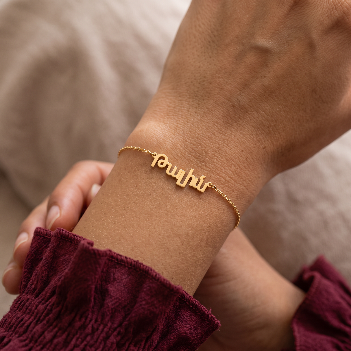 Custom Language Bracelet worn on the wrist, personalised name in another language