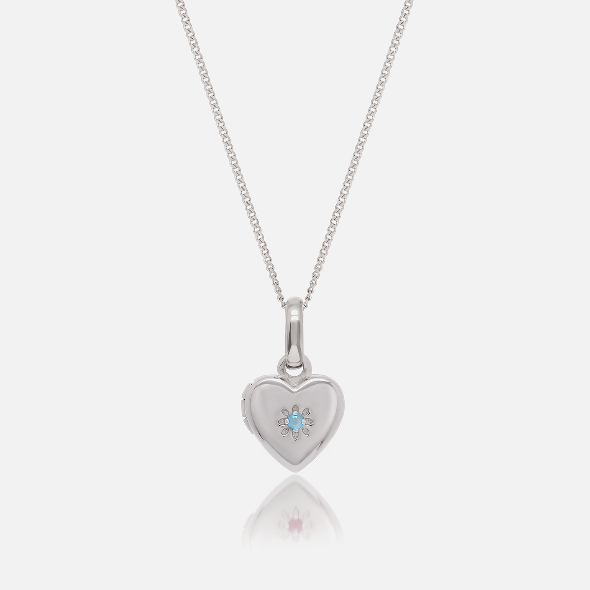 Close-up of the Silver Birthstone Heart Locket with March Aquamarine birthstone – Jewelled Me