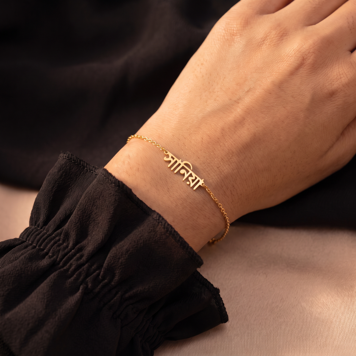 Custom Language Bracelet worn on the wrist, personalised name in another language